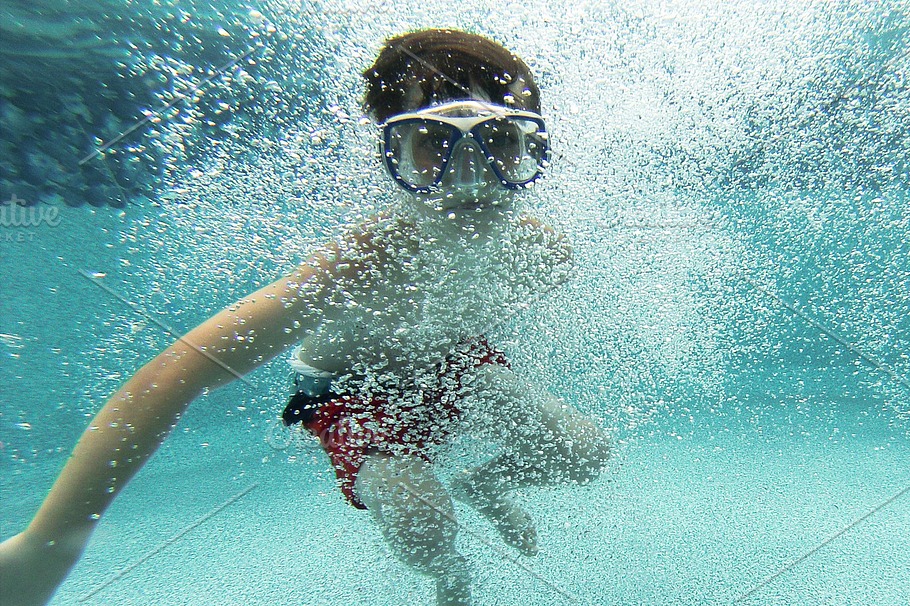 Popular Swimming Aids, person swimming with goggles